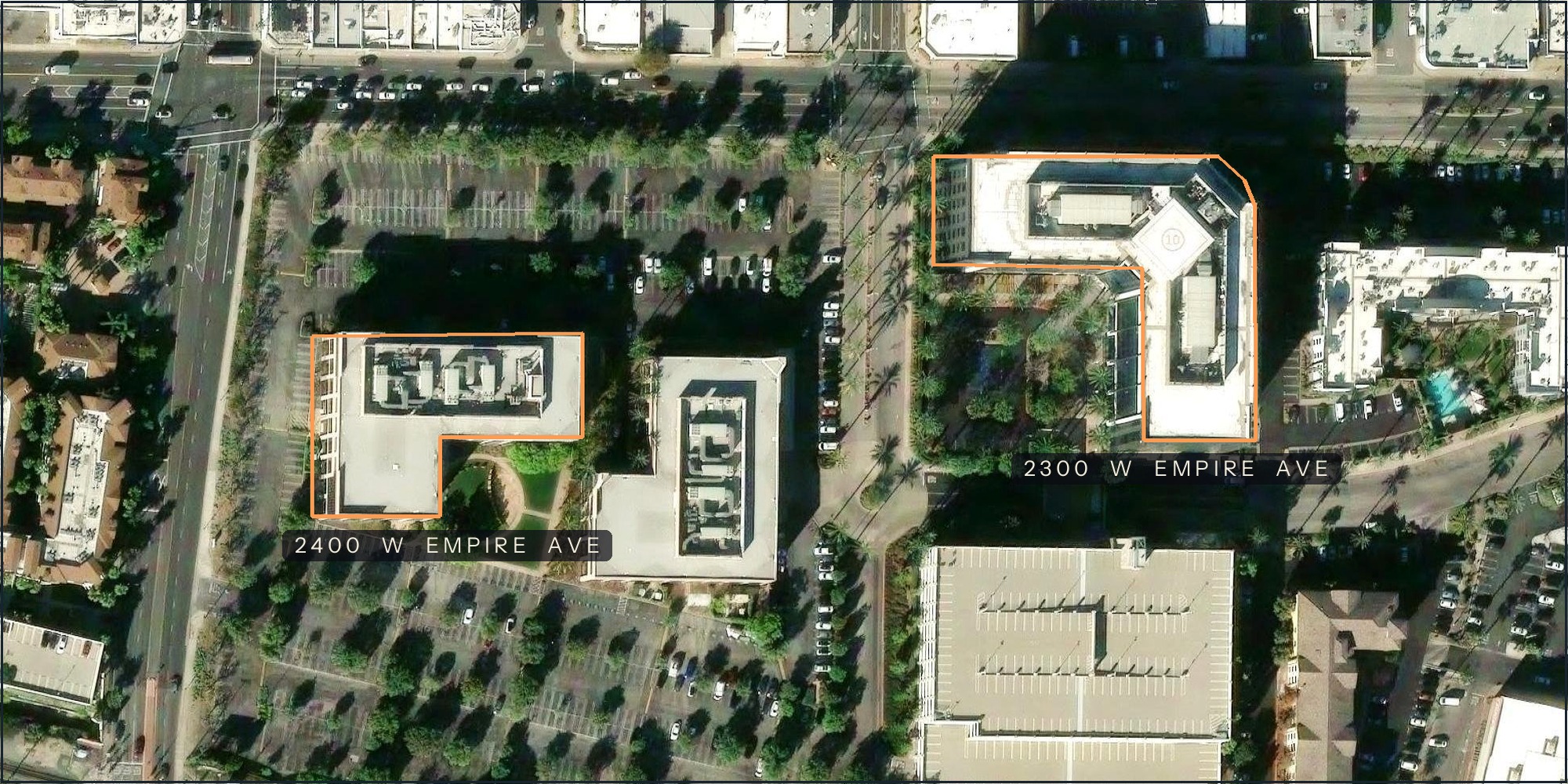 Netflix Animation Headquarters campus in Burbank — aerial view of the two Empire campus buildings, their rooftops outlined in amber